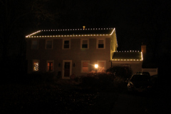 Classic warm white mini lights outlining the roofline for a magical winter wonderland feel. 