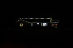 Professional holiday light installation . Check out this clean roofline lighting and wreaths for a cozy, elegant holiday feel.