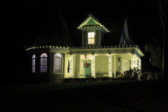 Custom Christmas lighting design featuring warm white LEDs and professional installation to make the home shine.