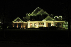Roofline Christmas lighting installation creating a welcoming, elegant holiday display in Finksburg, MD.