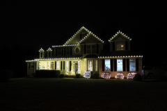 Classic White Christmas lights outlining this home for a clean, classic holiday aesthetic.