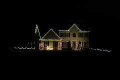 Professional holiday lighting installation in Maryland . A classic warm white roofline lights creating a timeless holiday glow.