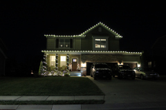 Ellicott City Christmas display. Elegant warm white roofline and pillar lights for a timeless holiday design.